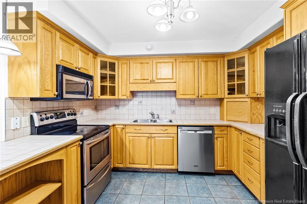 1 Golf Greens Lane Unit# 409, Fredericton, New Brunswick  E3B 9T9 - Photo 23 - NB136037