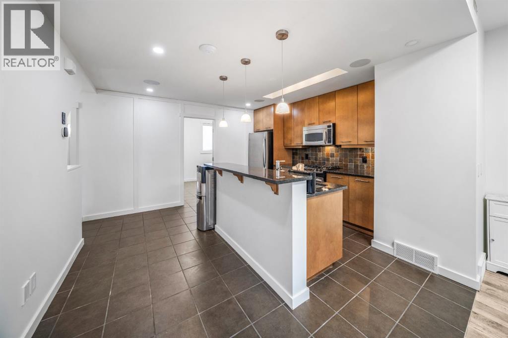 156 9 Street NE, Calgary, Alberta  T2E 0P4 - Photo 7 - A2287780