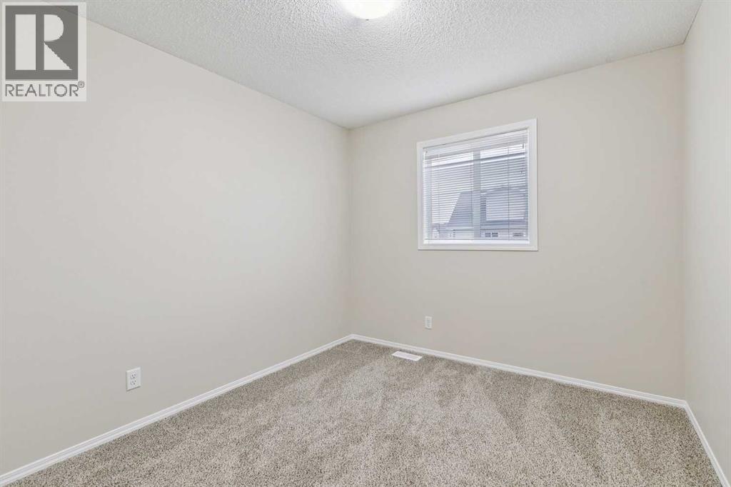 475 Cimarron Boulevard, Okotoks, Alberta  T1S 0J6 - Photo 21 - A2293283