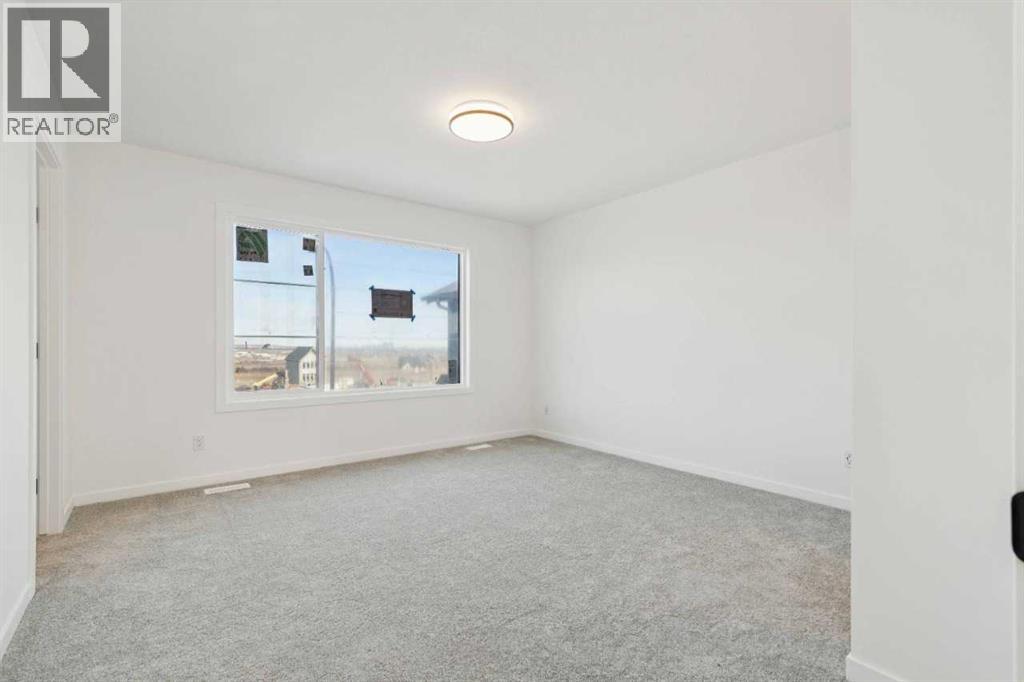 90 Bluerock Hill SW, Calgary, Alberta  T2Y 0V6 - Photo 18 - A2284600