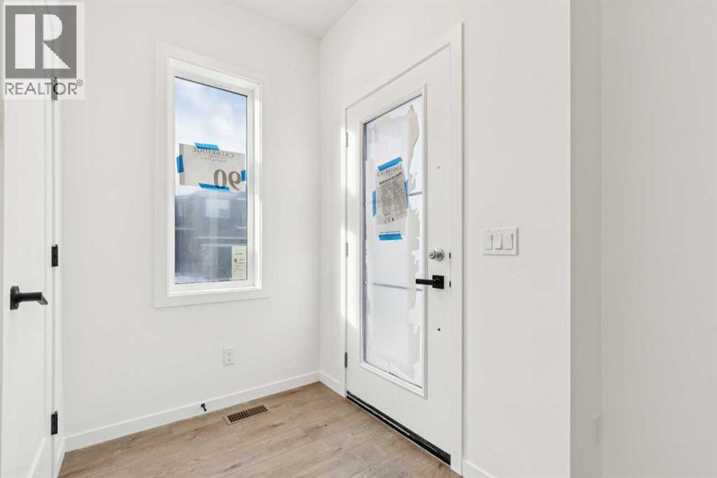 90 Bluerock Hill SW, Calgary, Alberta  T2Y 0V6 - Photo 3 - A2284600