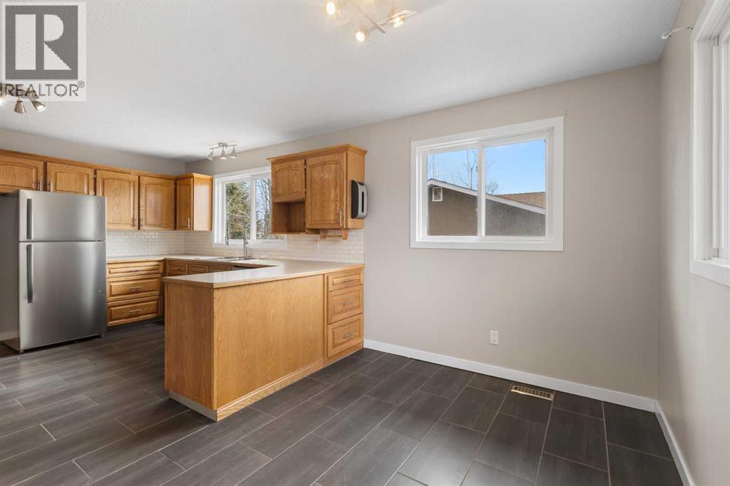 7604 Hunterfield Road NW, Calgary, Alberta  T2K 4L3 - Photo 6 - A2294509