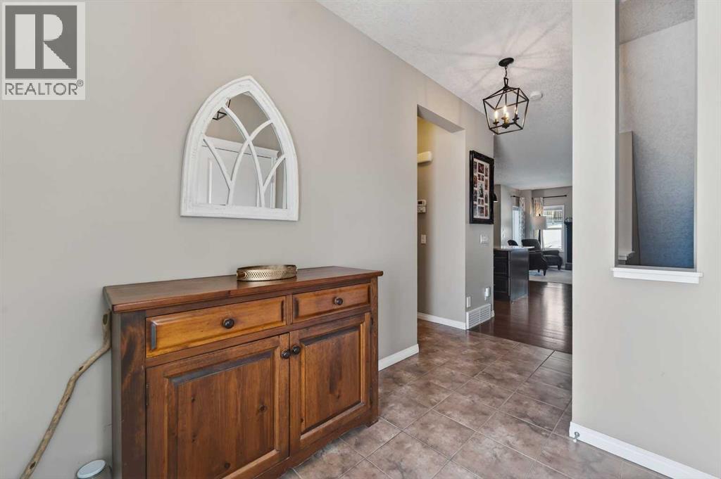 183 Reunion Grove Nw, Airdrie, Alberta  T4B 0Z3 - Photo 4 - A2297729