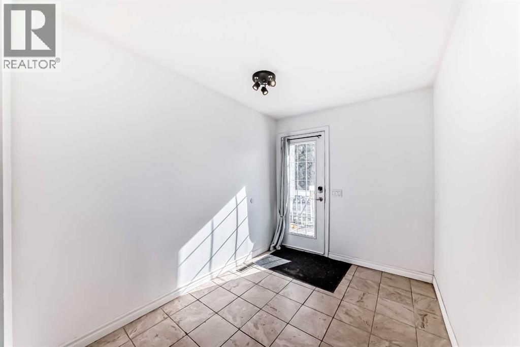 212 78 Avenue NE, Calgary, Alberta  T2K 0R2 - Photo 3 - A2289672