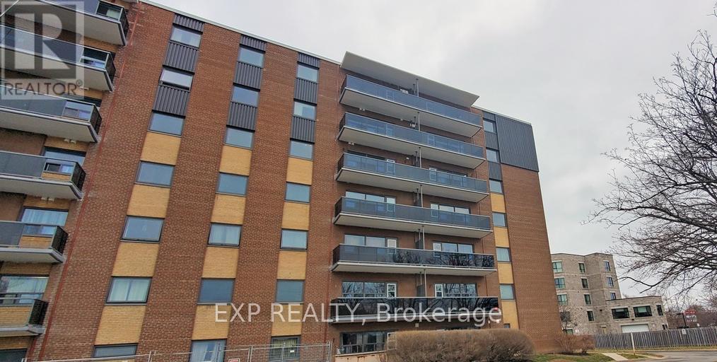 106 - 375 Scott Street, St. Catharines, Ontario  L2M 3W3 - Photo 1 - X12940006