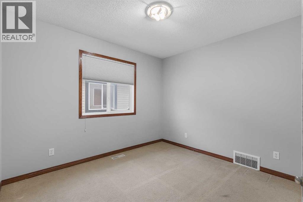1409 Kings Heights Boulevard SE, Airdrie, Alberta  T4A 0A1 - Photo 25 - A2275325