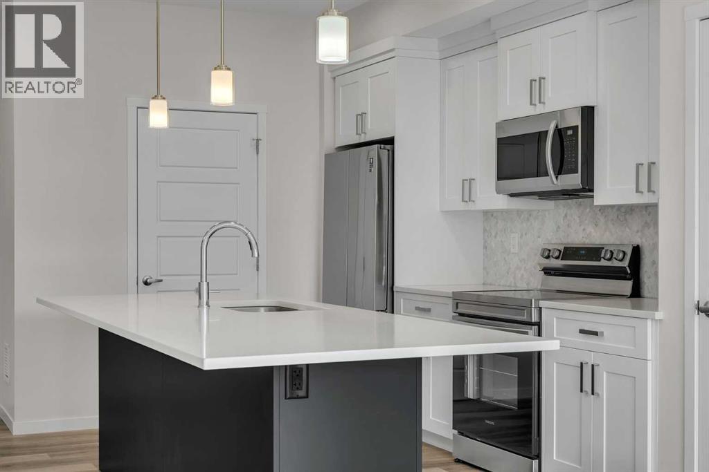 410, 200 Harvest Hills Place Ne, Calgary, Alberta  T3K 2N3 - Photo 3 - A2296524