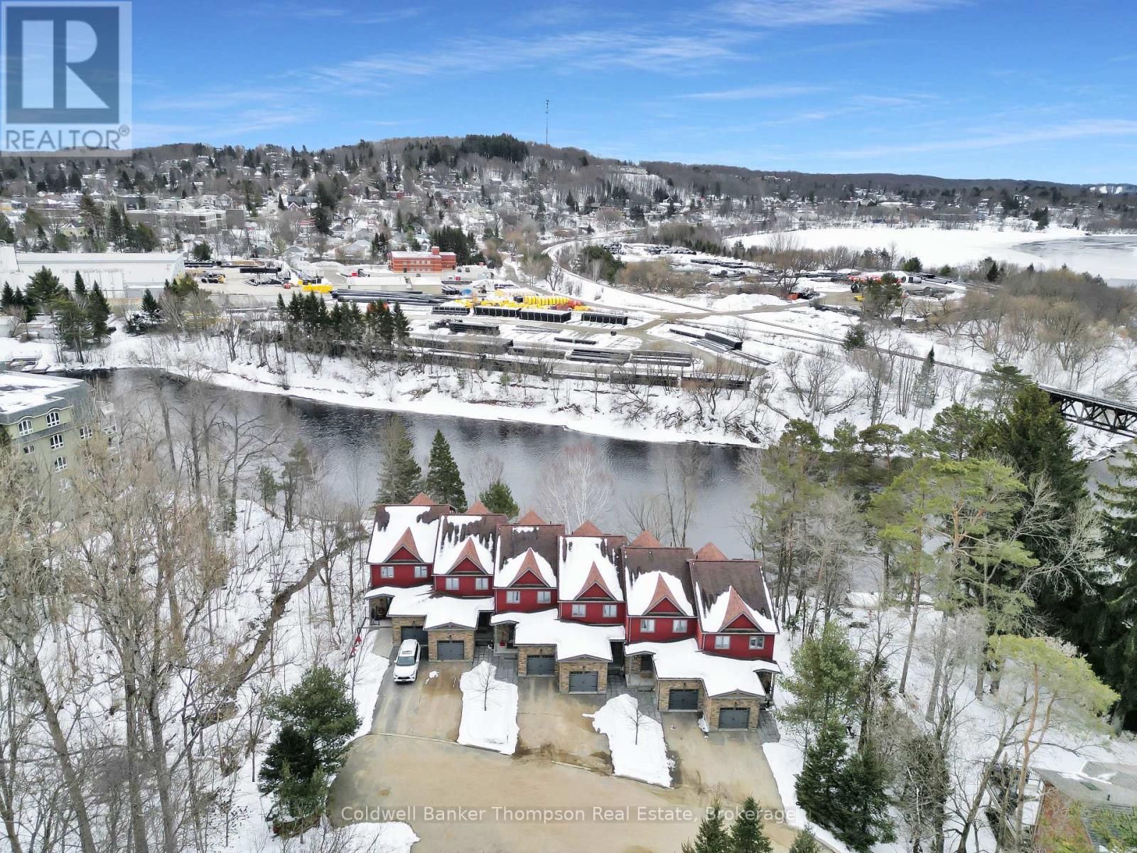 <div class="slider-price">$999,900</div><p>2 - 23 Winona Drive, Huntsville, Ontario</p>