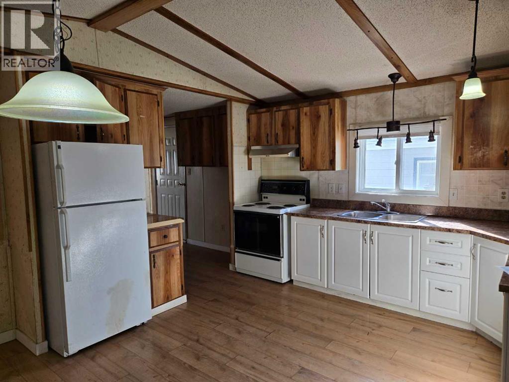 115 Sunset Way Ne, High River, Alberta  T1V 1J4 - Photo 3 - A2297994