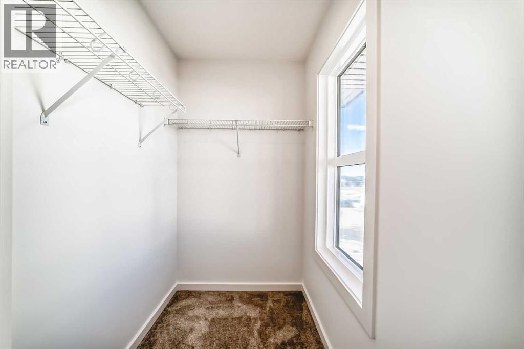 67 Creekside Path SW, Calgary, Alberta  T2X 5V9 - Photo 25 - A2294127