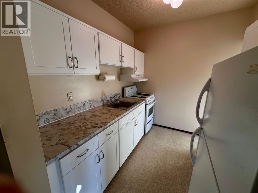 447 Huntsville Crescent NW, Calgary, Alberta  T3K 4W3 - Photo 25 - A2293800