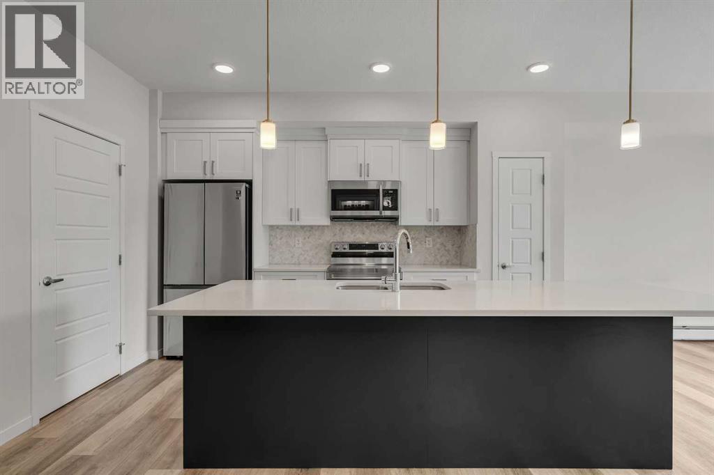 410, 200 Harvest Hills Place NE, Calgary, Alberta  T3K 2N3 - Photo 4 - A2296524