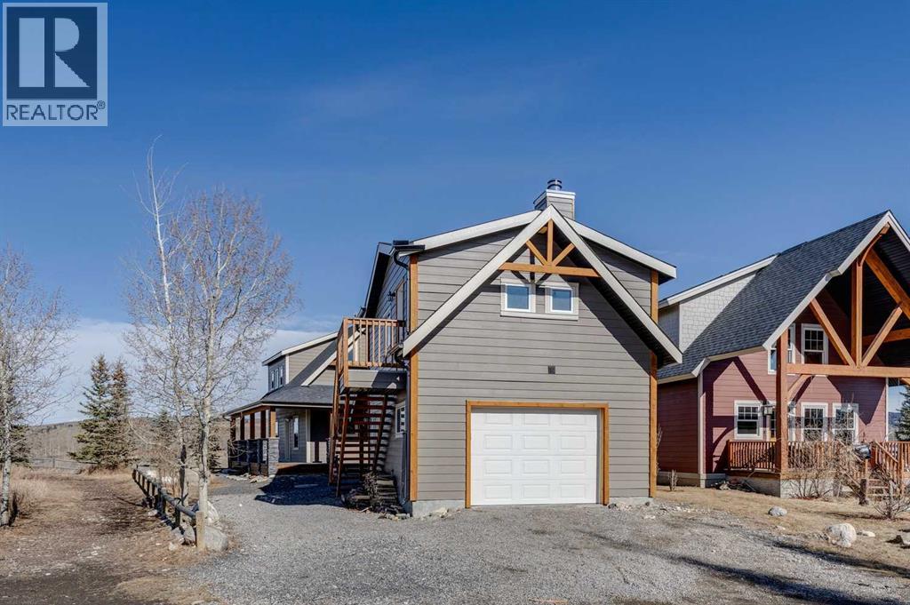 240 Cottageclub Crescent, Rural Rocky View County, Alberta T4C 1B1 - Photo 19 - A2298150