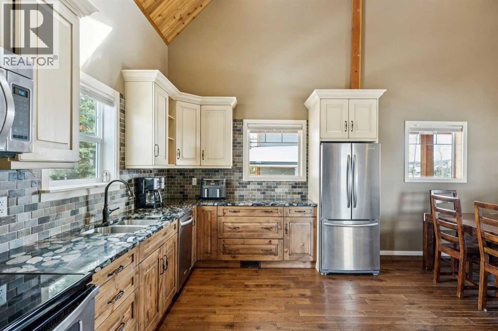 240 Cottageclub Crescent, Rural Rocky View County, Alberta T4C 1B1 - Photo 6 - A2298150