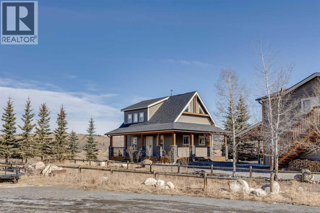 240 Cottageclub Crescent, Rural Rocky View County, Alberta T4C 1B1 - Photo 2 - A2298150