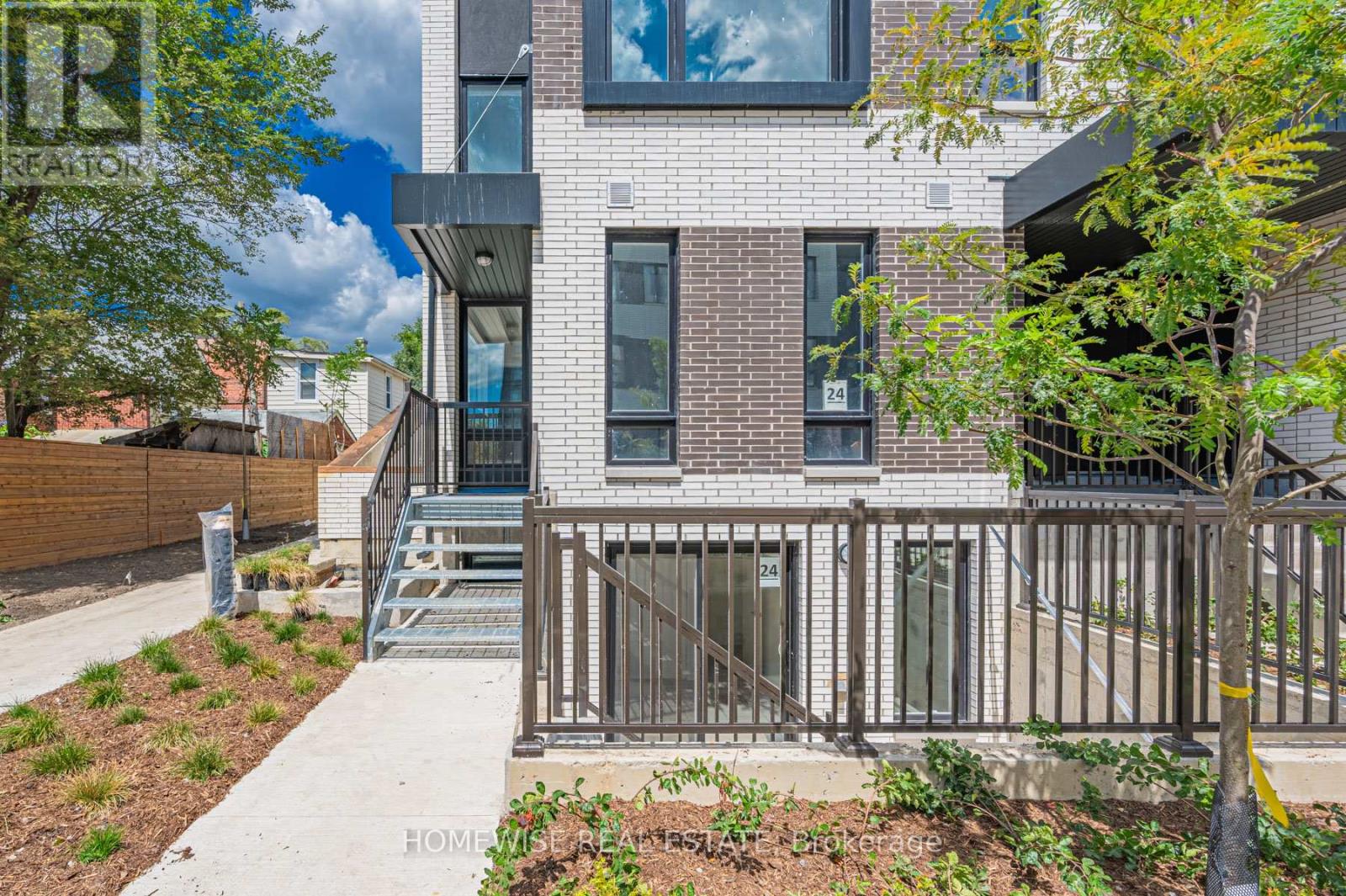 Th8 - 20 Ed Clark Gardens, Toronto, Ontario  M6N 0B5 - Photo 3 - W12950636