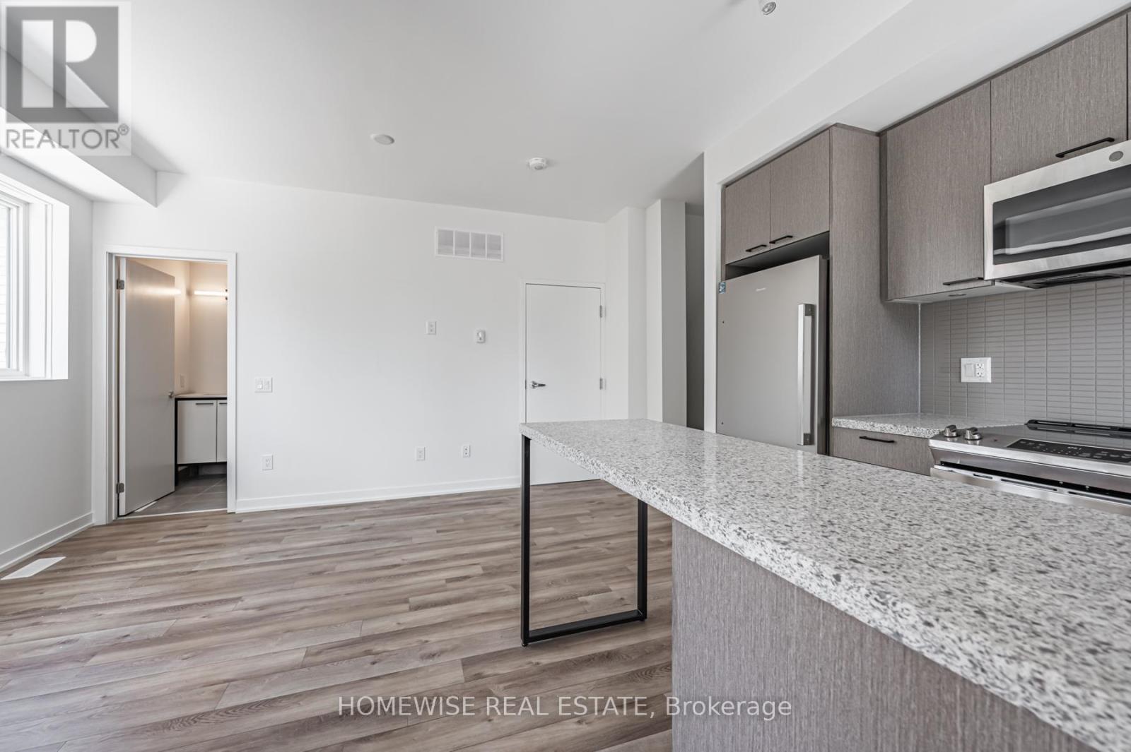 Th8 - 20 Ed Clark Gardens, Toronto, Ontario  M6N 0B5 - Photo 6 - W12950636