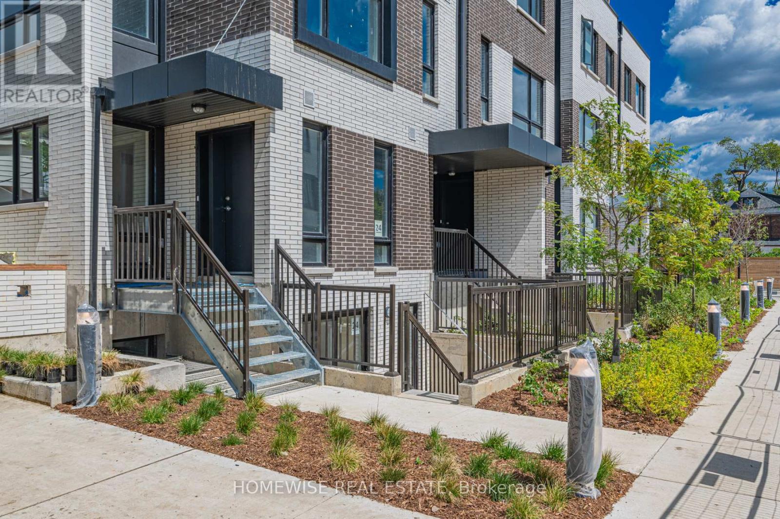 Th8 - 20 Ed Clark Gardens, Toronto, Ontario  M6N 0B5 - Photo 2 - W12950676