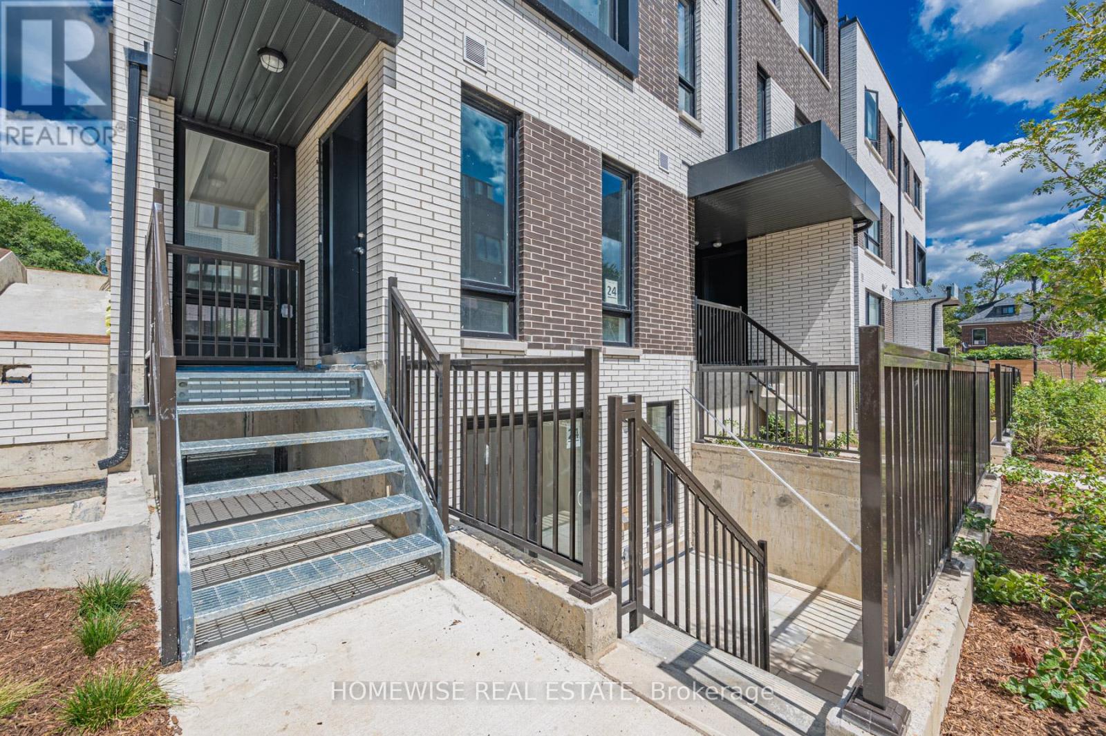 Th8 - 20 Ed Clark Gardens, Toronto, Ontario  M6N 0B5 - Photo 4 - W12950676