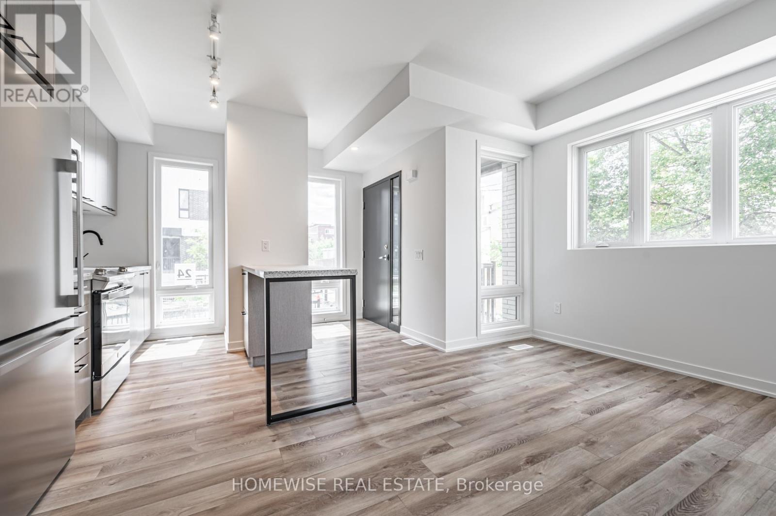 Th8 - 20 Ed Clark Gardens, Toronto, Ontario  M6N 0B5 - Photo 6 - W12950676