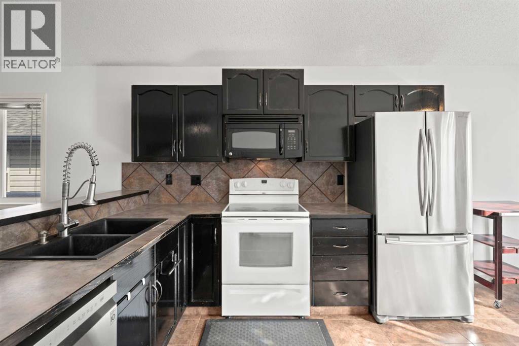 145 Cimarron Grove Circle, Okotoks, Alberta  T1S 2M1 - Photo 10 - A2297989