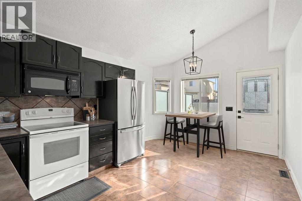 145 Cimarron Grove Circle, Okotoks, Alberta  T1S 2M1 - Photo 7 - A2297989