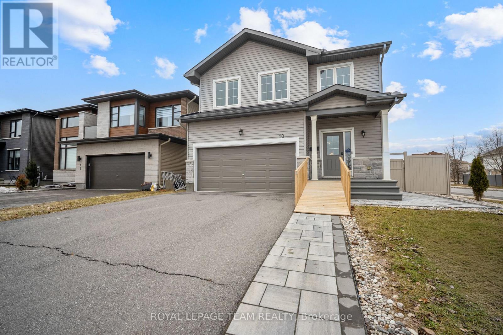 Welcome to 10 Kinetic Way, a home that offers a rare combination of space, flexibility, and true main floor living in the heart of Barrhaven. What really sets this home apart is the layout. You have a spacious primary bedroom on the main level with its own ensuite and walk in closet, making everyday living comfortable and convenient. Right beside it, there is a second bedroom and full bathroom, which works beautifully as a guest room, home office, or space for family. The main living area is bright, open, and very functional. It flows naturally from the kitchen to the dining and living space, making it ideal for both everyday living and entertaining. Upstairs, you will find two additional bedrooms, a full bathroom, and a flexible loft space that can be used as a second living area, office, or reading nook. Step outside to a fully finished, maintenance free backyard where you can relax and enjoy without the upkeep. Located directly across from Cobble Hill Park with no front neighbours, this home offers beautiful open views and access to green space right at your doorstep. You are also just minutes to major highways, restaurants, shopping, and everyday amenities, making day to day living incredibly convenient. This is a home that truly adapts to your lifestyle, whether you are looking to simplify, grow into it, or create a comfortable multigenerational setup. (id:48254)