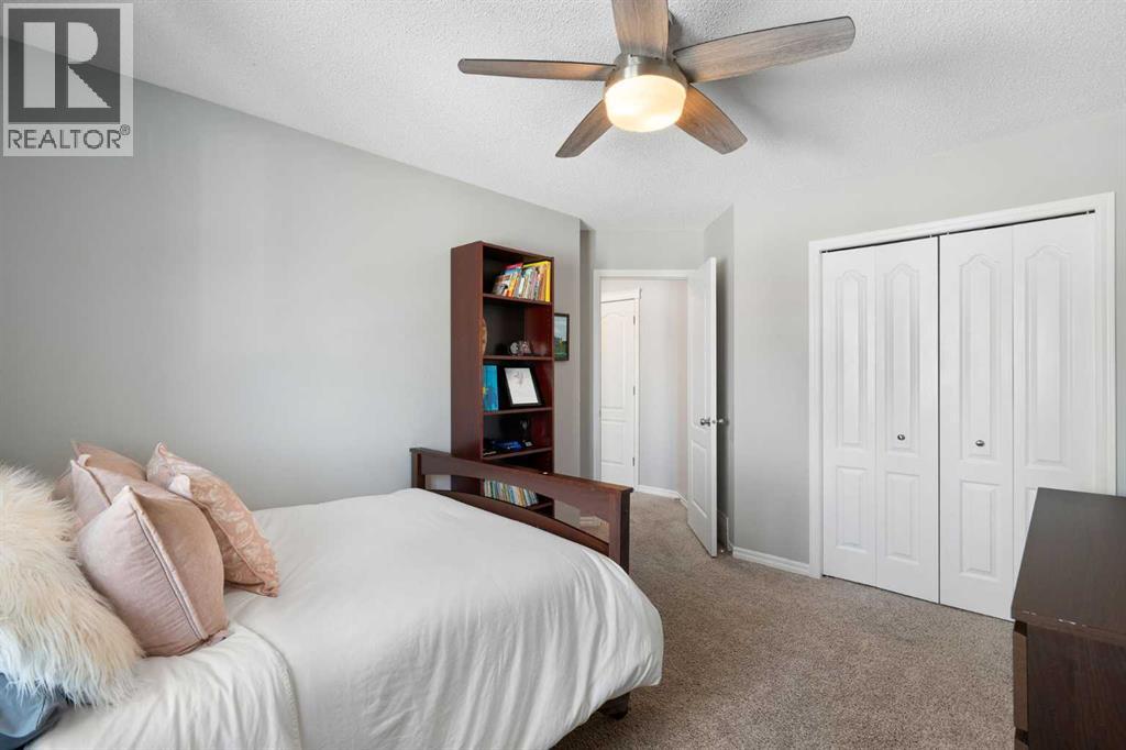 142 Coopers Bay Sw, Airdrie, Alberta  T4B 3K2 - Photo 30 - A2298253