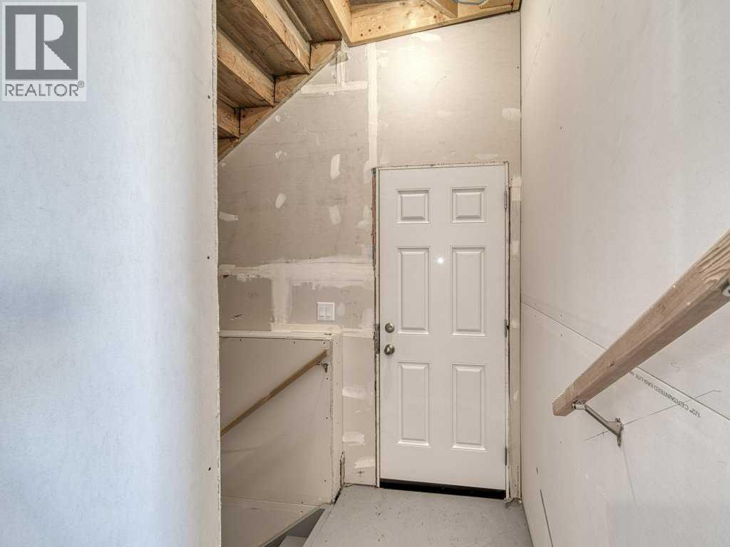 105 Creekstone Manor Sw, Calgary, Alberta  T2X 5W5 - Photo 30 - A2297741