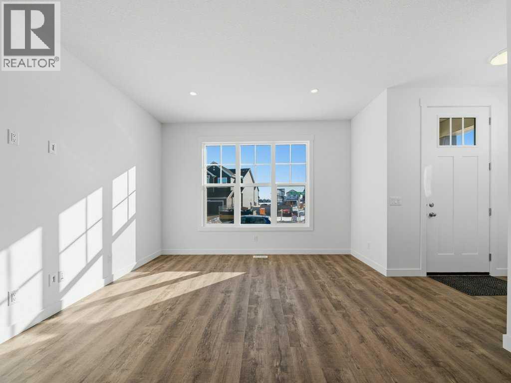 105 Creekstone Manor Sw, Calgary, Alberta  T2X 5W5 - Photo 5 - A2297741