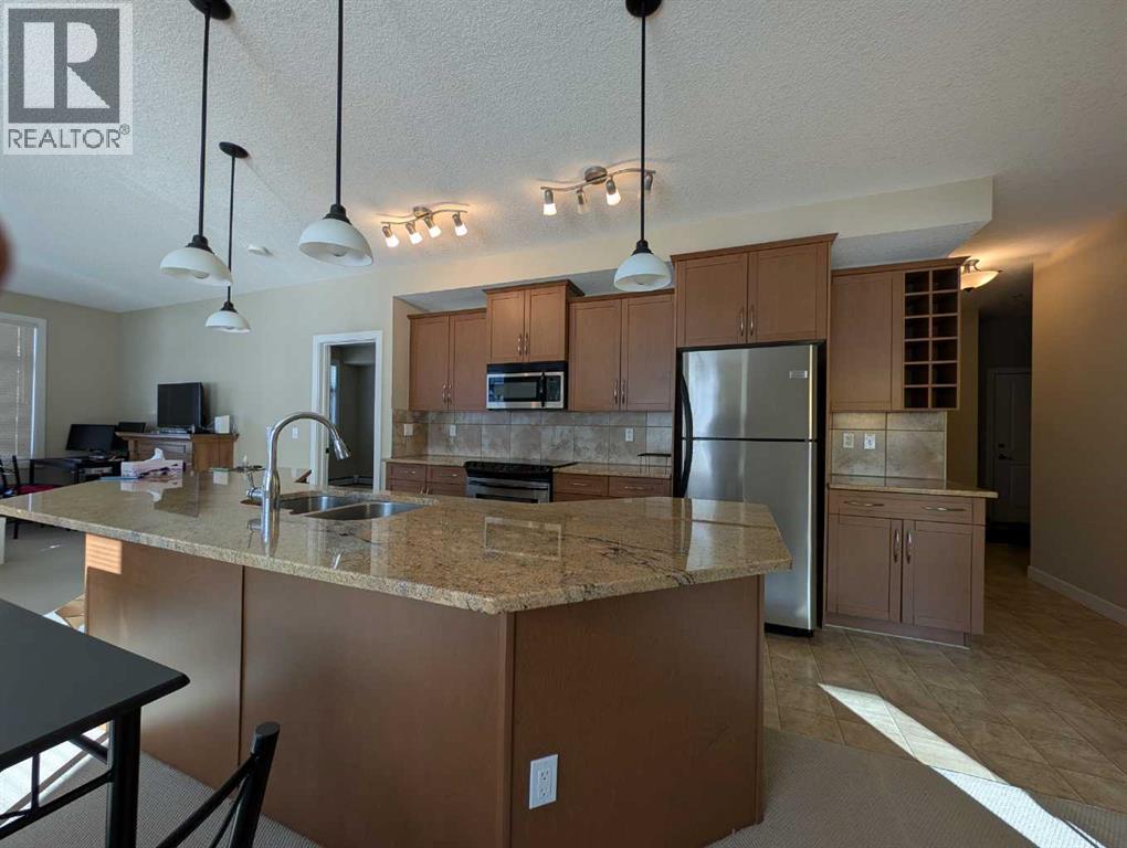 203, 35 Aspenmont Heights SW, Calgary, Alberta  T3H 0E5 - Photo 4 - A2291530