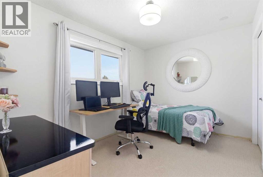 7 Woodmont Rise SW, Calgary, Alberta  T2W 4L4 - Photo 23 - A2298701