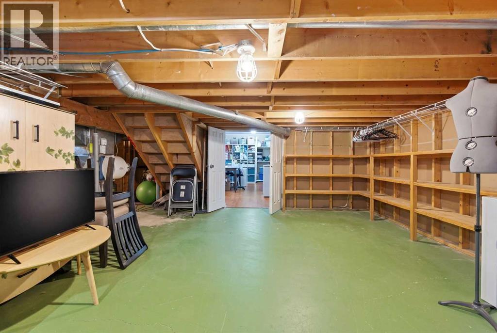 7 Woodmont Rise SW, Calgary, Alberta  T2W 4L4 - Photo 46 - A2298701