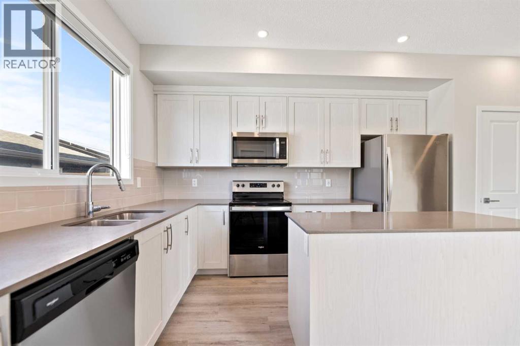 281 Creekside Boulevard SW, Calgary, Alberta  T2X 4X9 - Photo 8 - A2267008