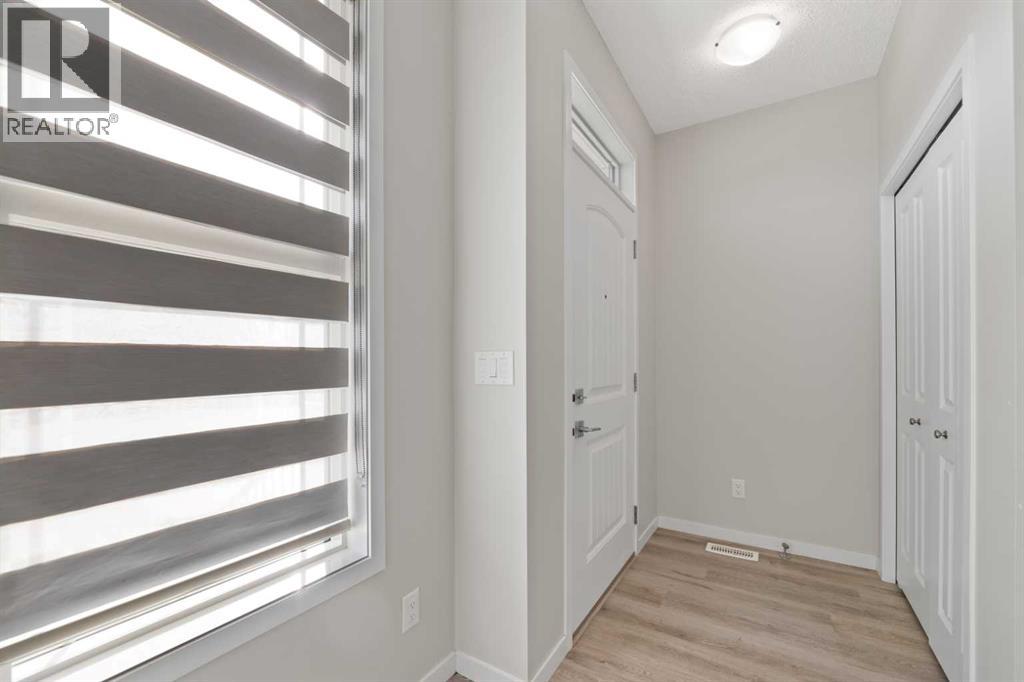 281 Creekside Boulevard SW, Calgary, Alberta  T2X 4X9 - Photo 3 - A2267008