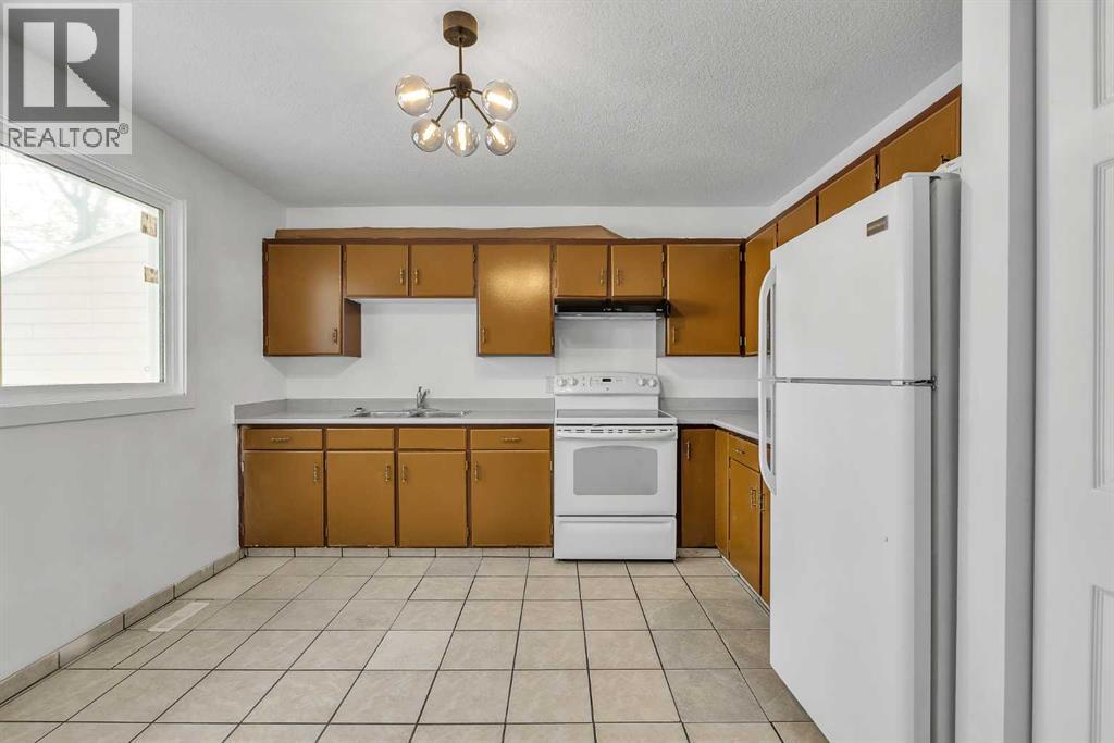 318 Marlborough Way NE, Calgary, Alberta  T2A 6R9 - Photo 5 - A2299339