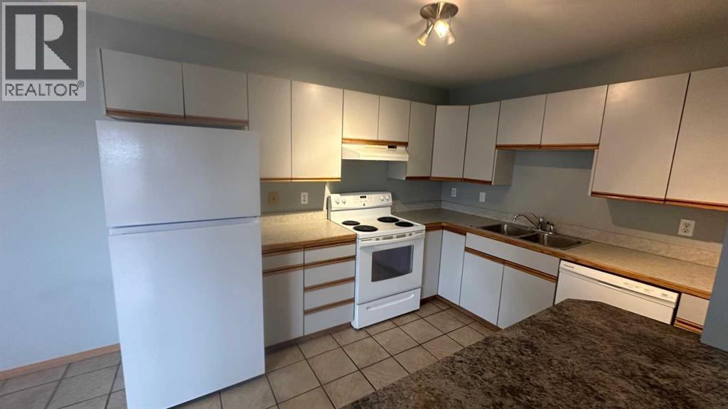 8, 6203 Bowness Road NW, Calgary, Alberta  T3B 0E2 - Photo 4 - A2296202