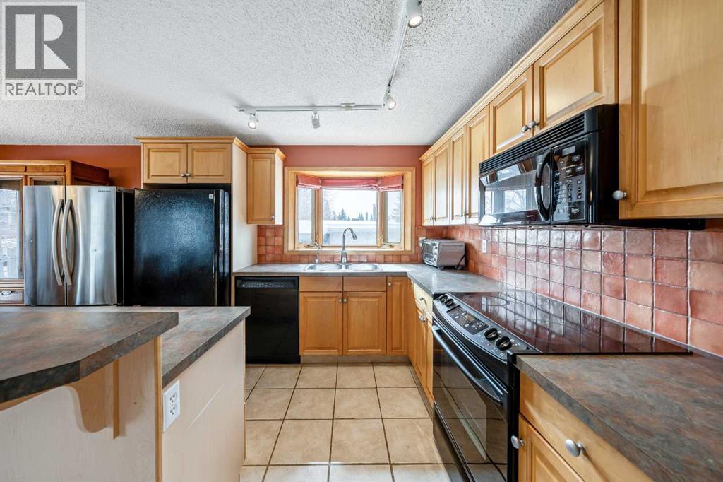 1017 Mckinnon Drive NE, Calgary, Alberta  T2E 6A7 - Photo 6 - A2298191