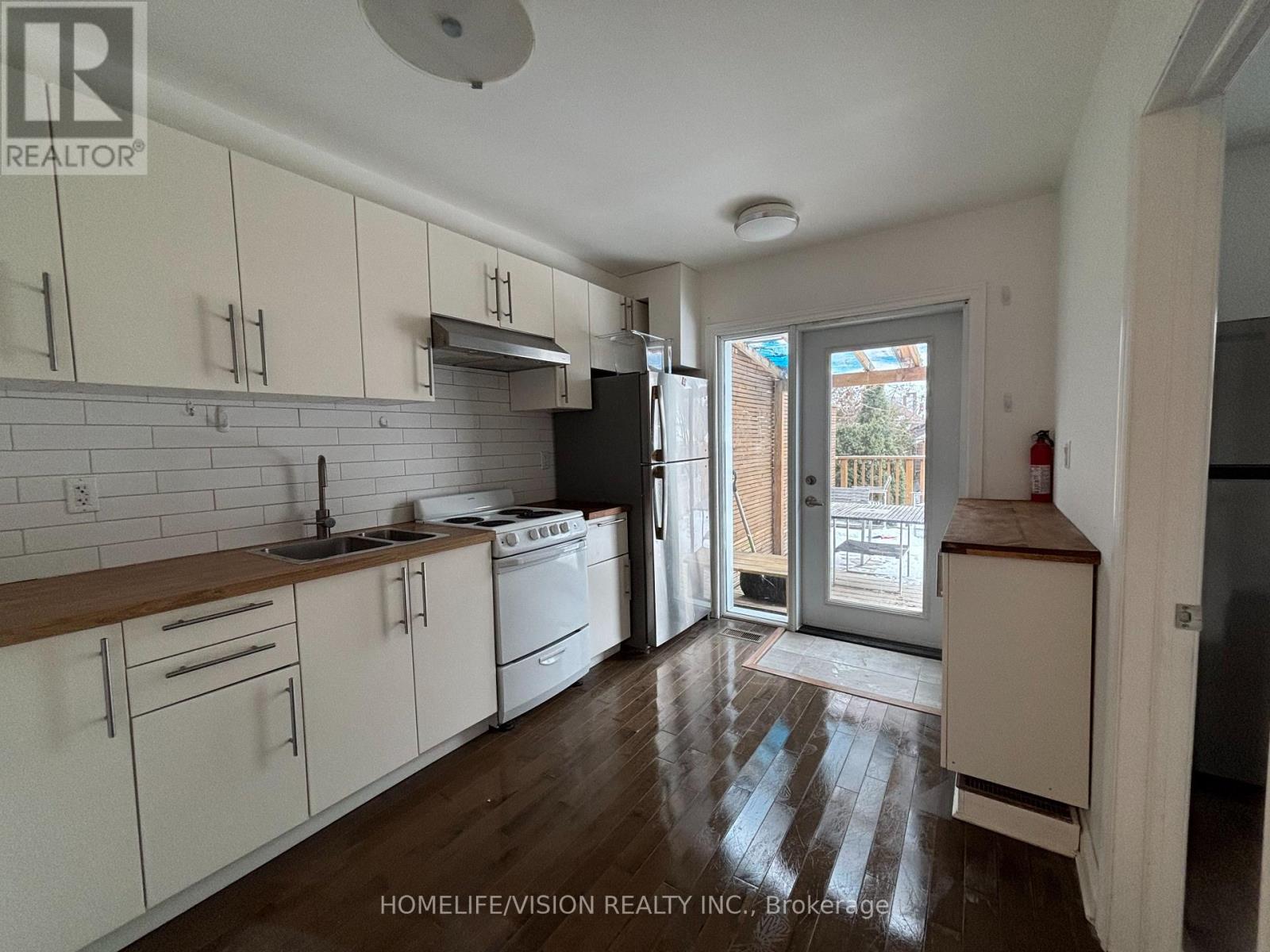 Main - 143 Belgravia Avenue, Toronto, Ontario  M6E 2M6 - Photo 6 - W12965572
