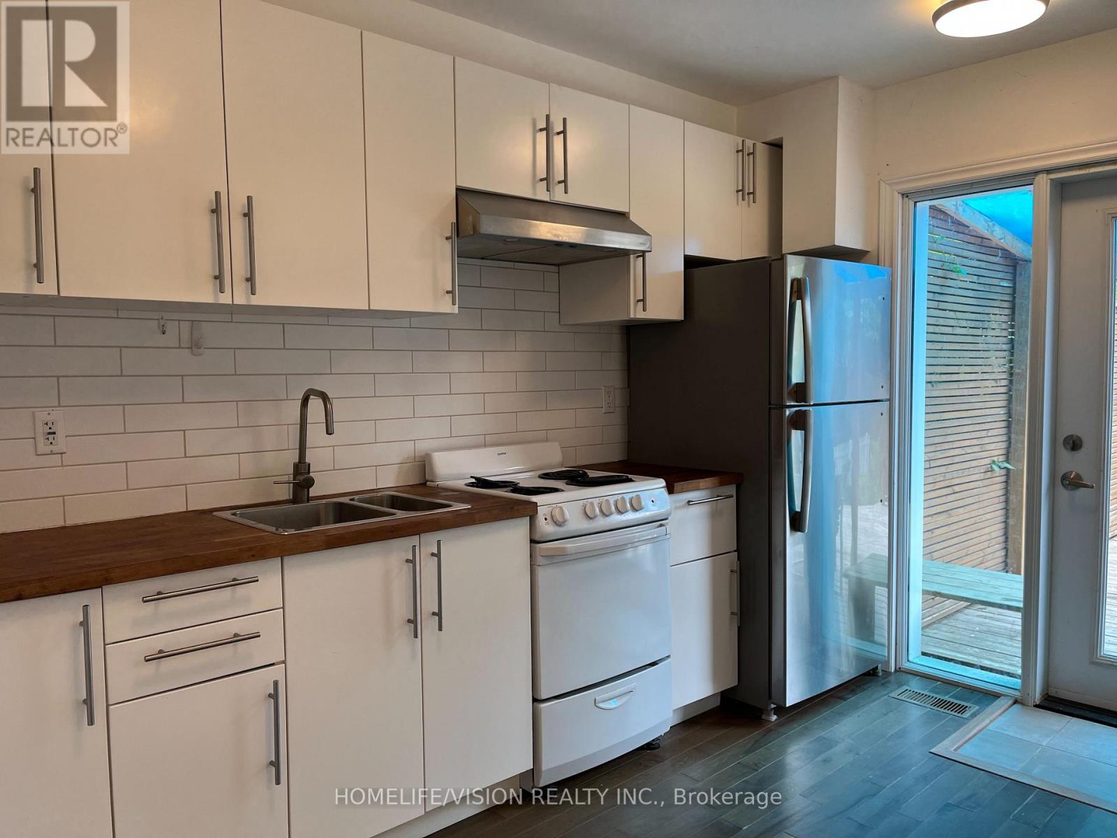 Main - 143 Belgravia Avenue, Toronto, Ontario  M6E 2M6 - Photo 7 - W12965572