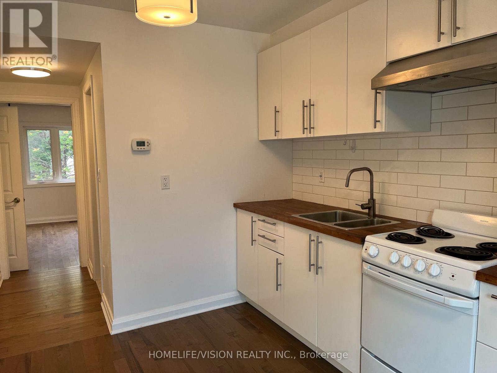 Main - 143 Belgravia Avenue, Toronto, Ontario  M6E 2M6 - Photo 9 - W12965572