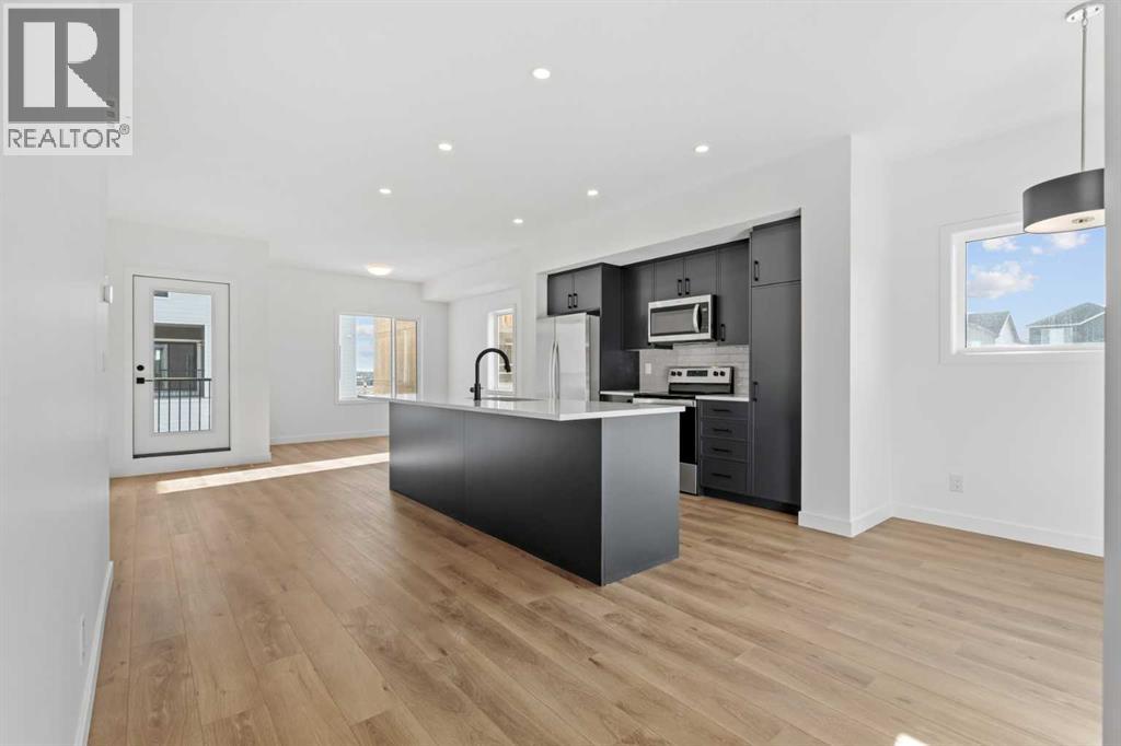 1115, 25 Wildwoods Court Sw, Airdrie, Alberta  T4B 5V7 - Photo 3 - A2283791