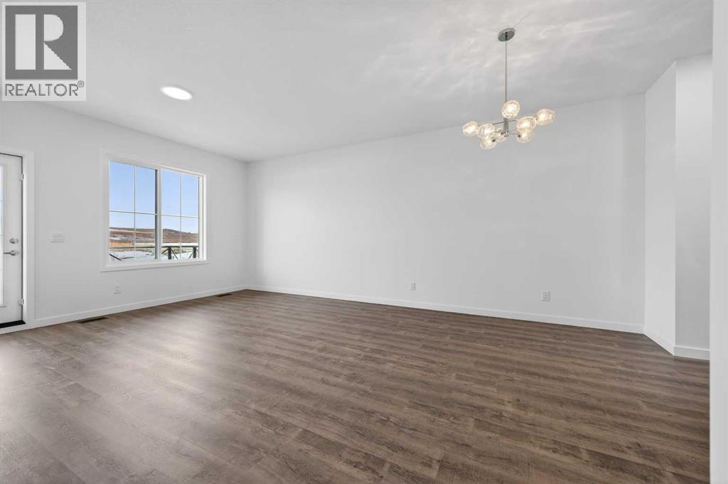 56 Creekside Drive SW, Calgary, Alberta  T2X 6E2 - Photo 2 - A2282815