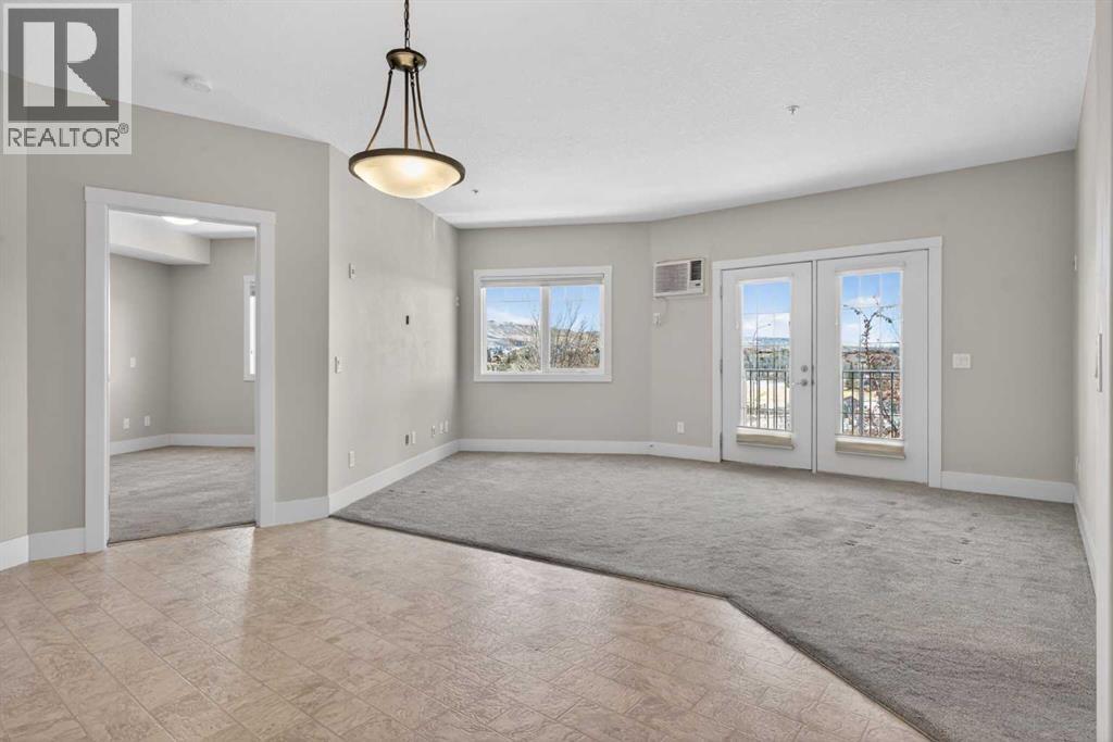 203, 77 George Fox Trail, Cochrane, Alberta  T4C 0N1 - Photo 27 - A2295000