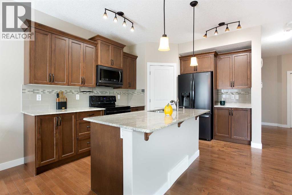 147 Morningside Mews Sw, Airdrie, Alberta  T4B 0X2 - Photo 7 - A2297845