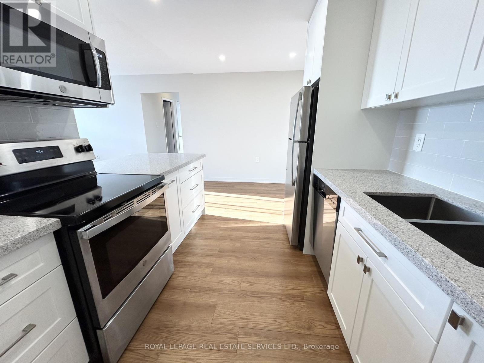 303 - 82 Millside Drive, Milton, Ontario  L9T 4A1 - Photo 9 - W12971174