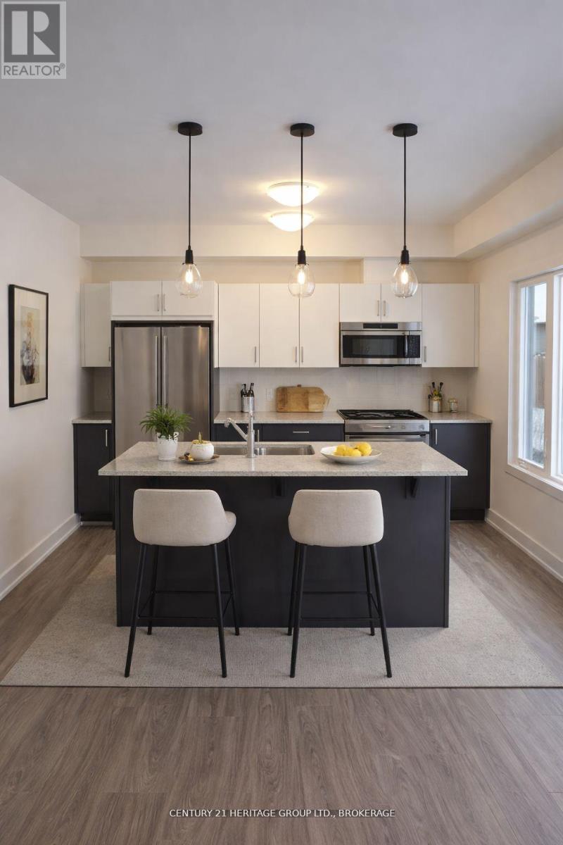 66 Dusenbury Drive, Loyalist, Ontario  K0H 2H0 - Photo 4 - X12972206