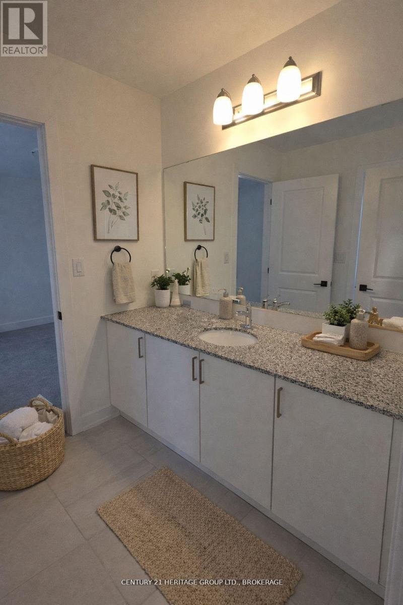 66 Dusenbury Drive, Loyalist, Ontario  K0H 2H0 - Photo 6 - X12972206