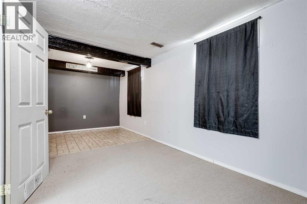 21 Mountain Circle SE, Airdrie, Alberta  T4A 1X8 - Photo 32 - A2299433