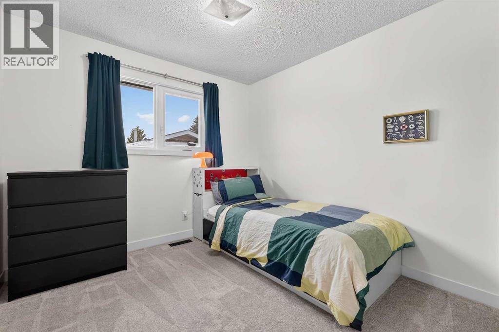 584 Woodhill Place SW, Calgary, Alberta  T2W 3L5 - Photo 22 - A2298867